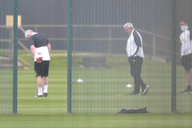 Head coach Steve Bruce, centre, on the training pitch.