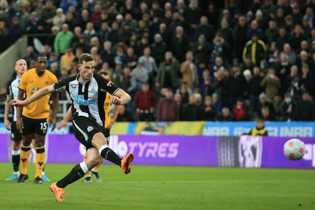 Chris Wood scoring for Newcastle United against Wolves (Photo by LINDSEY PARNABY/AFP via Getty Images)