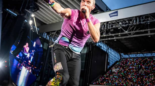 Coldplay performs at Parken Stadium in Copenhagen. Photo by Mads Claus Rasmussen / Ritzau Scanpix / AFP via Getty Images