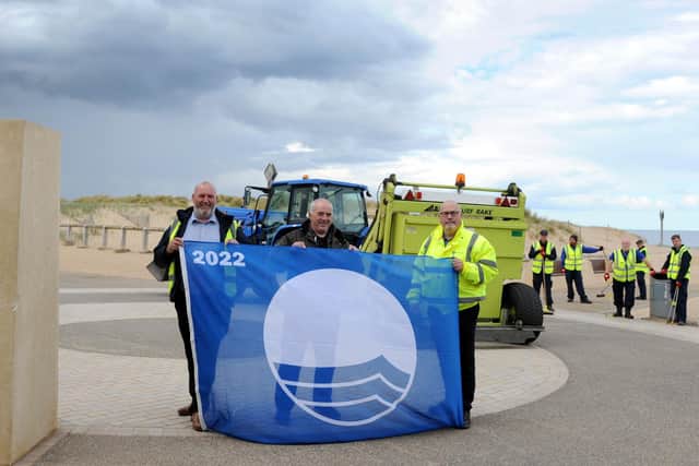 Cllr Ernest Gibson with South Tyneside Homes Handy Estates assistant manager Eddie Hope, and Outdoor Facilities officer Allan Maving, with Sandhaven's Blue Flag award. Picture issued by South Tyneside Council.