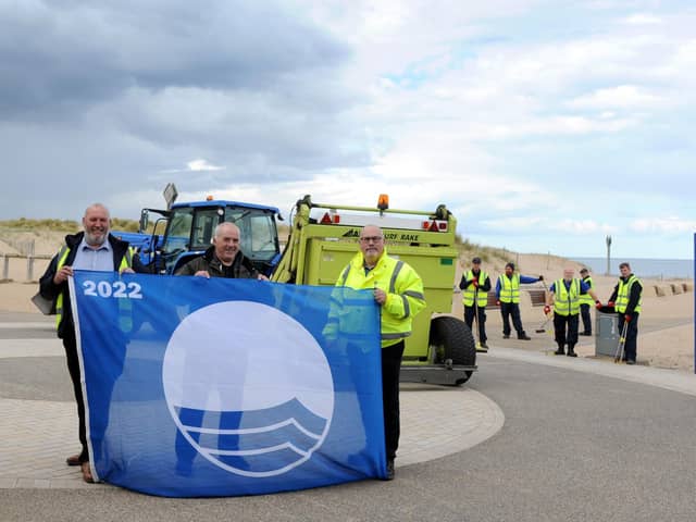 Cllr Ernest Gibson with South Tyneside Homes Handy Estates assistant manager Eddie Hope, and Outdoor Facilities officer Allan Maving, with Sandhaven's Blue Flag award. Picture issued by South Tyneside Council.