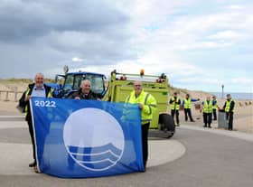 Cllr Ernest Gibson with South Tyneside Homes Handy Estates assistant manager Eddie Hope, and Outdoor Facilities officer Allan Maving, with Sandhaven's Blue Flag award. Picture issued by South Tyneside Council.