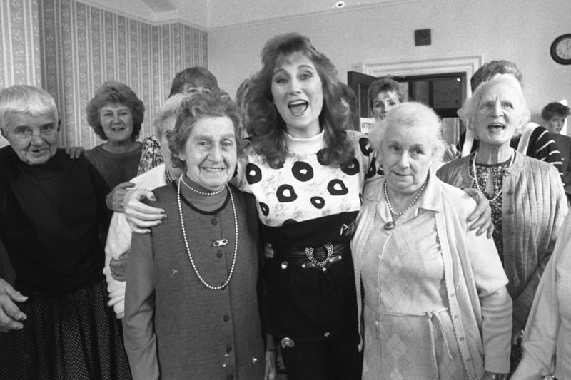 Popular Irish singer Rose Marie enjoys a singalong with residents at the Owton Fens old people's home during a surprise visit in October 1988.