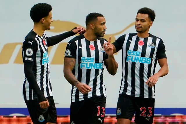 Newcastle United's English striker Callum Wilson (C) celebrates scoring the opening goal from the penalty spot during the English Premier League football match between Newcastle United and Everton at St James' Park in Newcastle-upon-Tyne, north east England on November 1, 2020.