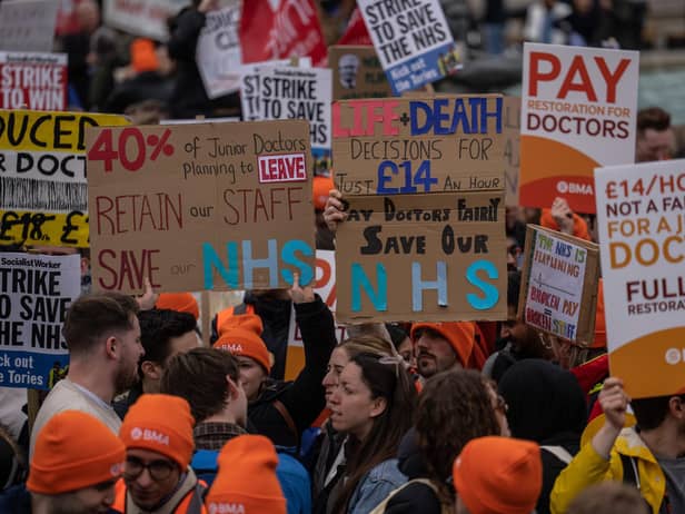 Junior doctors take part in a rally in Trafalgar Square during a nationwide strike on April 11, 2023 in London. Junior doctors in England are held a 96-hour walkout hoping to achieve full pay restoration after seeing their pay cut by more than a quarter since 2008. (Photo by Carl Court/Getty Images)