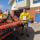 From left: Mark Taylor, Michael Brown  and Mark Charlton with their commendation certificates. Photo: RNLI/James Waters.