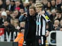 Eddie Howe, Manager of Newcastle United, interacts with Anthony Gordon of Newcastle United during the Premier League match between Newcastle United and West Ham United at St. James Park on February 04, 2023 in Newcastle upon Tyne, England. (Photo by Ian MacNicol/Getty Images)