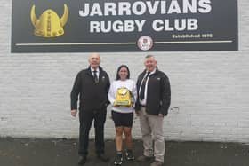 From left: Tom Wilson, rugby club member and stalwart of Luke's Lane Community Centre, fundraiser Ashleigh Gascoigne holding the defibrillator and Brian Berry, Jarrovians RUFC chairman.