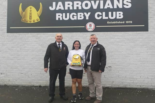 From left: Tom Wilson, rugby club member and stalwart of Luke's Lane Community Centre, fundraiser Ashleigh Gascoigne holding the defibrillator and Brian Berry, Jarrovians RUFC chairman.