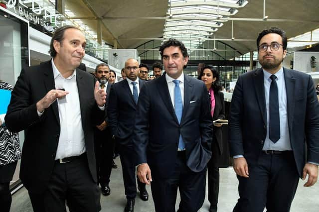 (L to R) Iliad Group founder and Vice President Xavier Niel, Saudi managing director of the Public Investment Fund Yasir Al-Rumayyan and French Junior Minister for the Digital Sector Mounir Mahjoubi visit the "Station F" start up campus in Paris, on April 9, 2018. / AFP PHOTO / BERTRAND GUAY        (Photo credit should read BERTRAND GUAY/AFP via Getty Images)