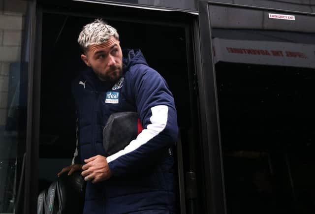 LONDON, ENGLAND - FEBRUARY 09: Charlie Austin of West Bromwich Albion arrives at the stadium prior to the Sky Bet Championship match between Millwall and West Bromwich Albion at The Den on February 09, 2020 in London, England. (Photo by Alex Pantling/Getty Images)