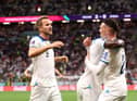 Bukayo Saka celebrates with Harry Kane and Phil Foden after scoring England's third goal against Senegal (Photo by Catherine Ivill/Getty Images)