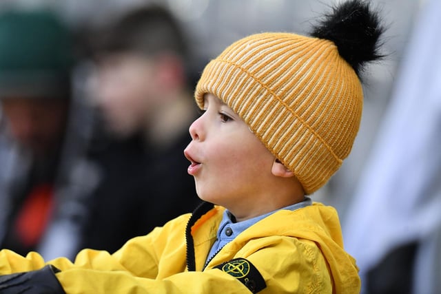 One young fan cheers on the current generation of Newcastle United stars