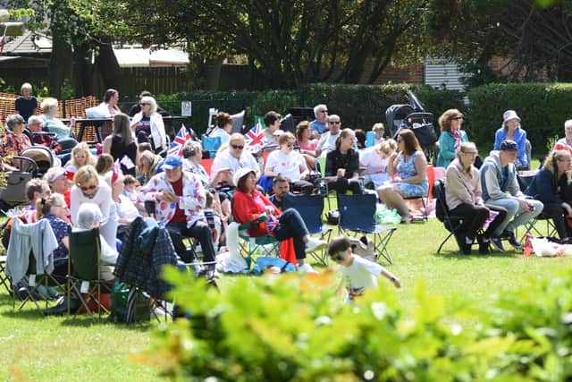 Large groups of carers enjoy the sunshine in Readhead Park as part of the Queens Platinum Jubilee celebrations.