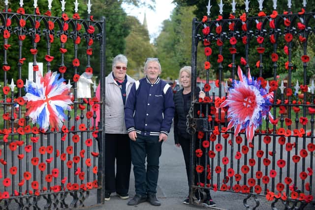 Remembrance display by the Friends of Hebburn Cemetery. Volunteers Millie Venus and Karen Collins (R) with chairman John Stewart.