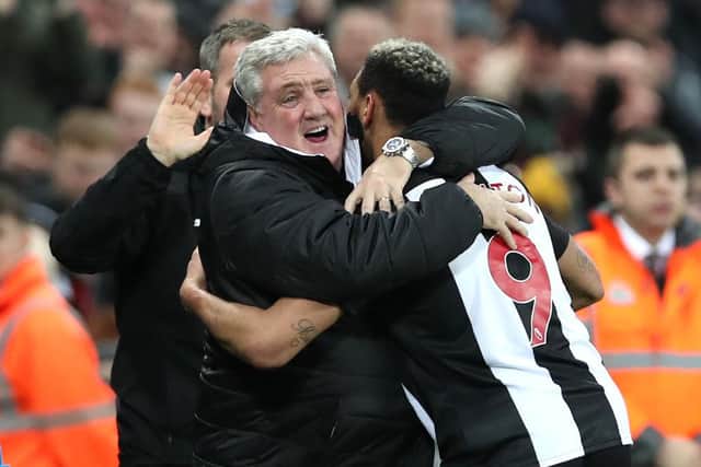NEWCASTLE UPON TYNE, ENGLAND - JANUARY 14: Joelinton of Newcastle United celebrates after escores his team's fourth goal  with Manager Steve Bruce during the FA Cup Third Round Replay match between Newcastle United and Rochdale at St. James Park on January 14, 2020 in Newcastle upon Tyne, England. (Photo by Ian MacNicol/Getty Images)