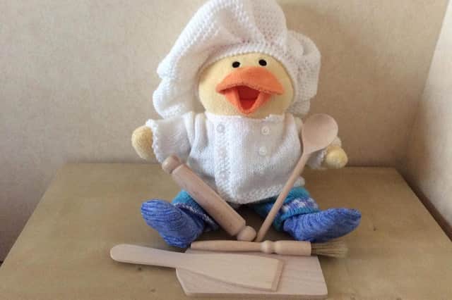 A Chemo Duck sporting a chef's outfit.