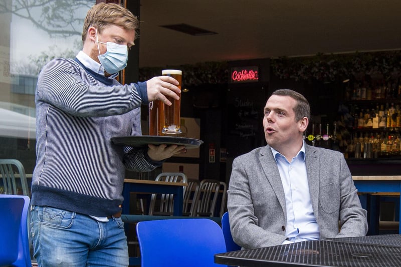 Scottish Conservative leader Douglas Ross pictured receiving a freshly poured pint of 'The Edinburgh Larger' from The Edinburgh Brewing Company at 56 North, Newington, as pubs reopen for the first time in months. 





SCOTLANDSCOVID RESTRICTIONS MOVE INTO LEVEL 3 TODAY WHICH MEAN PUB AND RESTAURANTS CAN RE-OPEN, WITH ALCOHOL PERMITTED TO BE DRANK OUTSIDE