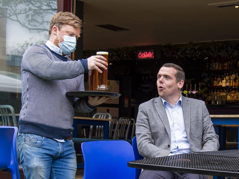 Scottish Conservative leader Douglas Ross pictured receiving a freshly poured pint of 'The Edinburgh Larger' from The Edinburgh Brewing Company at 56 North, Newington, as pubs reopen for the first time in months.
SCOTLANDSCOVID RESTRICTIONS MOVE INTO LEVEL 3 TODAY WHICH MEAN PUB AND RESTAURANTS CAN RE-OPEN, WITH ALCOHOL PERMITTED TO BE DRANK OUTSIDE