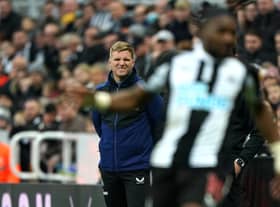 Newcastle United head coach Eddie Howe watches Allan Saint-Maximin from the dugout.