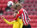 Oxford player Matt Taylor is challenged by Dion Sanderson of Sunderland during the Sky Bet League One match between Sunderland and Oxford United at Stadium of Light on April 02, 2021 in Sunderland, England.