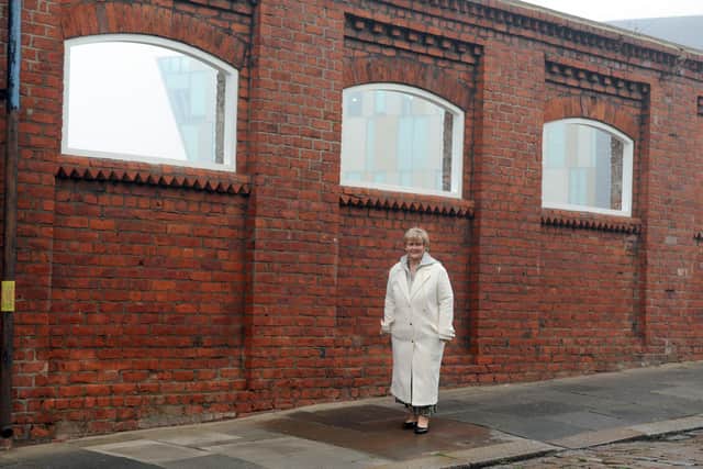 South Tyneside Council Leader Cllr Tracey Dixon and the newly opened windows at Mill Dam, South Shields.