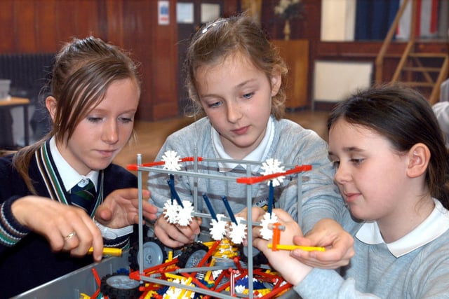 Here is a scene from 2007 and it shows a building design session at St Anthony's School. Vanessa Beales, 15, is showing St Patrick's School pupils Hannah Mather and Elle Thubron, both 10, a lesson in building.