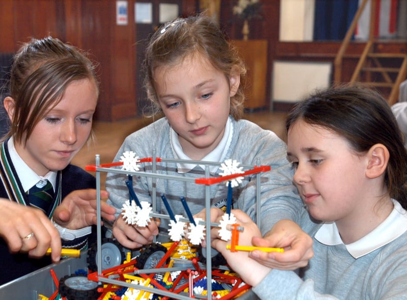 Here is a scene from 2007 and it shows a building design session at St Anthony's School. Vanessa Beales, 15, is showing St Patrick's School pupils Hannah Mather and Elle Thubron, both 10, a lesson in building.
