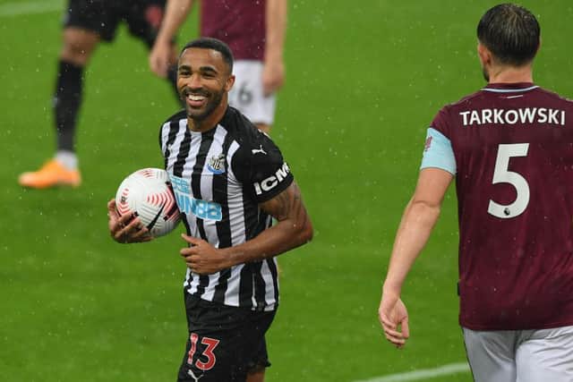 Newcastle striker Callum Wilson celebrates with the ball after scoring his first and Newcastle's second goal during the Premier League match between Newcastle United and Burnley at St. James Park on October 03, 2020 (Photo by Stu Forster/Getty Images)