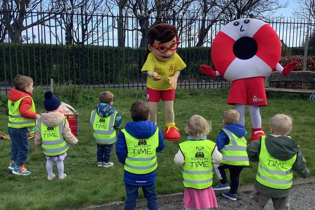 Youngsters with South Shields Volunteer Lifeguard Brigade mascots Belle and Perry.