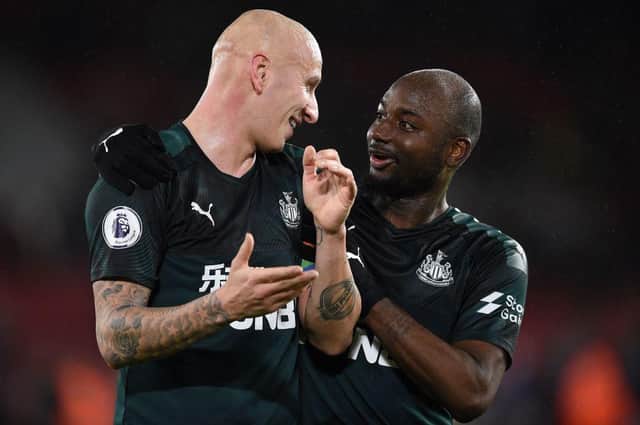 Newcastle United's English midfielder Jonjo Shelvey (L) and Newcastle United's Dutch defender Jetro Willems celebrate after the English Premier League football match between Sheffield United and Newcastle United at Bramall Lane stadium in Sheffield, northern England on December 5, 2019.