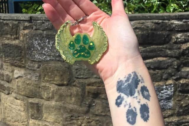 Lauren's tattoo of Ellie's paw print.