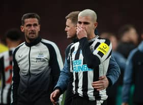 Newcastle United's Bruno Guimaraes of Newcastle United is consoled at the final whistle.