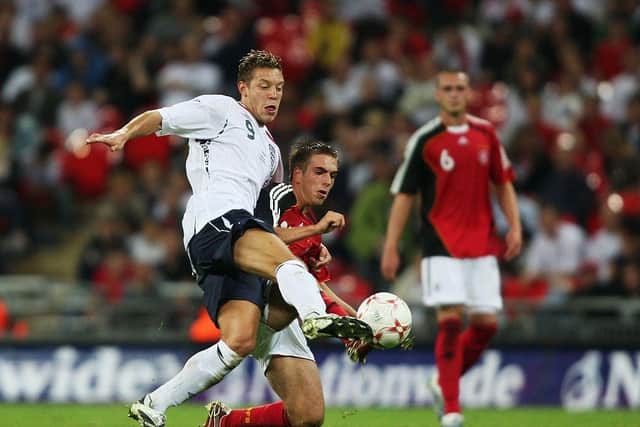 England's Alan Smith tussles with Philip Lahm of Germany at Wembley in 2007.