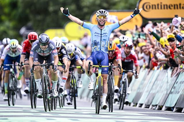 Sir Mark Cavendish celebrates as he crosses the line in Saint-Vulbas to win his record-breaking 35th Tour de France stage (Picture: JASPER JACOBS/BELGA MAG/AFP via Getty Images)