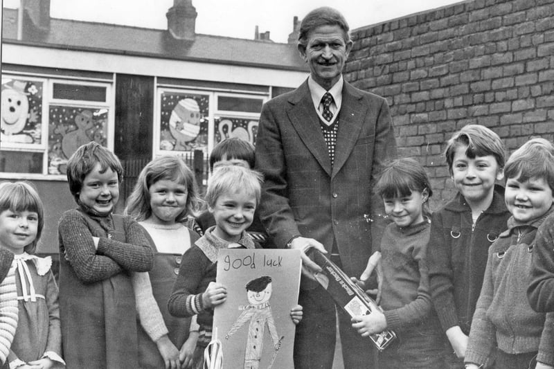 Caretaker Mr James Telford, retired from Barnes Road Infants School in 1979.   He is pictured being presented with a drill by Jane Dorothy, aged six, and a "Good Luck" card by Steven Oren, six.
