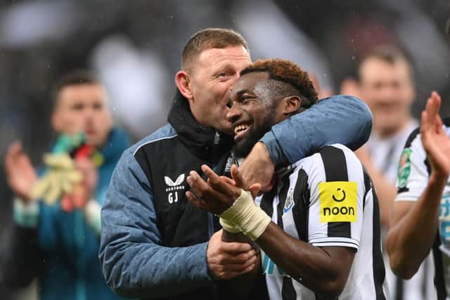 Newcastle United coach Graeme Jones embraces Allan Saint-Maximin after the Southampton game.