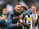 Newcastle United coach Graeme Jones embraces Allan Saint-Maximin after the Southampton game.
