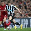 Newcastle United's English midfielder Elliot Anderson (R) vies with Liverpool's English midfielder James Milner (L) during the English Premier League football match between Liverpool and Newcastle United at Anfield in Liverpool, north west England on August 31, 2022. (Photo by PAUL ELLIS/AFP via Getty Images)