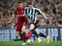 Newcastle United's English midfielder Elliot Anderson (R) vies with Liverpool's English midfielder James Milner (L) during the English Premier League football match between Liverpool and Newcastle United at Anfield in Liverpool, north west England on August 31, 2022. (Photo by PAUL ELLIS/AFP via Getty Images)