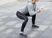 “Before you squat, you should get in position.That means keeping your feet about shoulder-width apart.” ​