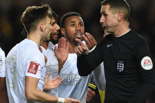 Arsenal's Kieran Tierney,  Mo Elneny and Gabriel appeal to referee David Coote during the Emirates FA Cup Third Round match between Oxford United and Arsenal at Kassam Stadium on January 09, 2023 in Oxford, England. (Photo by Stuart MacFarlane/Arsenal FC via Getty Images)