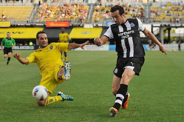 Sebastian Miranda #21 of the Columbus Crew attempts to stop a kick from Jose Enrique Sanchez #3 of Newcastle United FC on July 26, 2011 at Crew Stadium in Columbus, Ohio.   (Photo by Jamie Sabau/Getty Images)