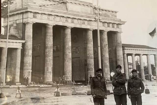 Eddie Lockney and two others as they carried out their National Service in Berlin in 1961, later telling his family he watched as people passed babies over the initial wall from East to West.