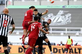 The players compete for the ball at St James's Park.