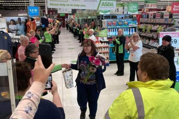 Staff formed a guard of honour for Sarah as she walked down the shopping aisle towards future husband Ian.