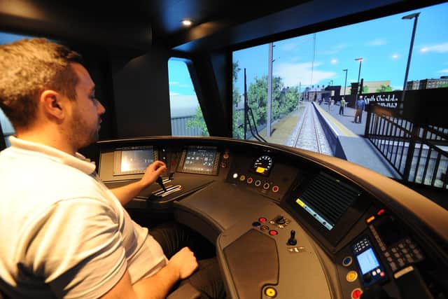 Michael Darling at the controls of the new simulator.