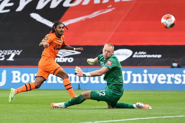 Newcastle United's Austrian midfielder Valentino Lazaro (L) scores his team's fourth goal during the English Premier League football match between Bournemouth and Newcastle United at the Vitality Stadium in Bournemouth, southern England on July 1, 2020.