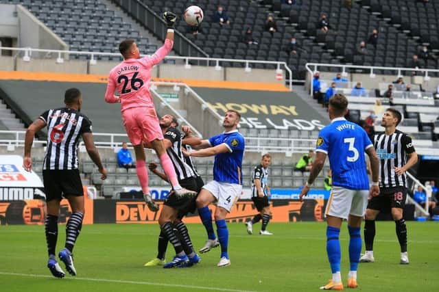 Newcastle United's English goalkeeper Karl Darlow punchest the ball away during the English Premier League football match between Newcastle United and Brighton and Hove Albion at St James' Park in Newcastle upon Tyne, north-east England on September 20, 2020.
