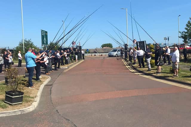 Friends of Lee lined the streets with their fishing rods in the air to give him a guard of honour as the funeral procession drove by.